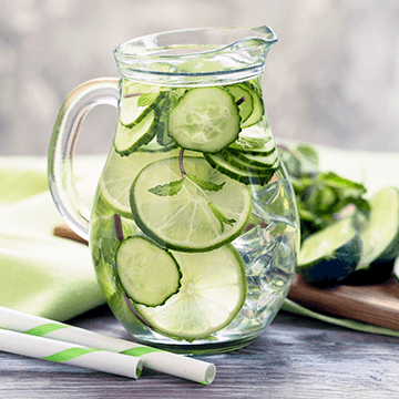 Cucumber water in a glass jar.